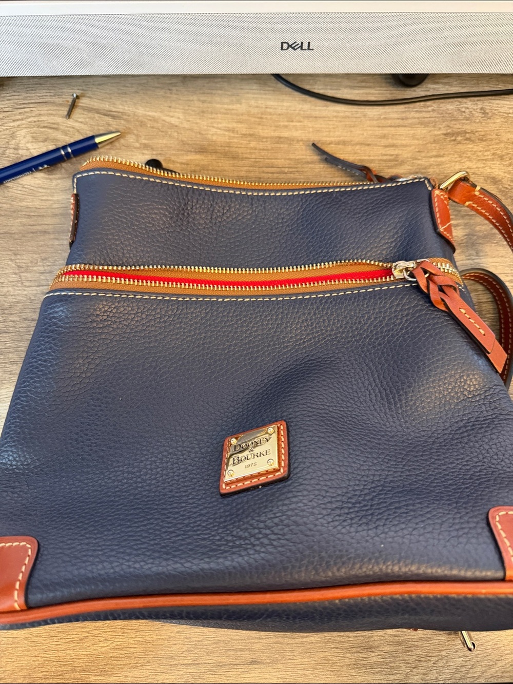 Dooney & Bourke Navy Leather Crossbody with Brown Trim and Red Zip Accent